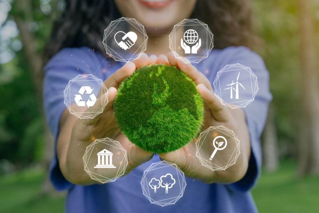 ESG concept of environmental, social and governance.Young woman holding green earth with ESG icon.